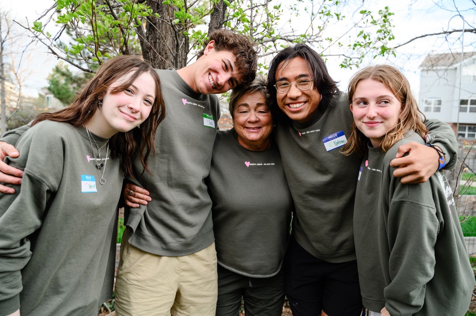Amy Mays with four student leaders, arms around each other, laughing