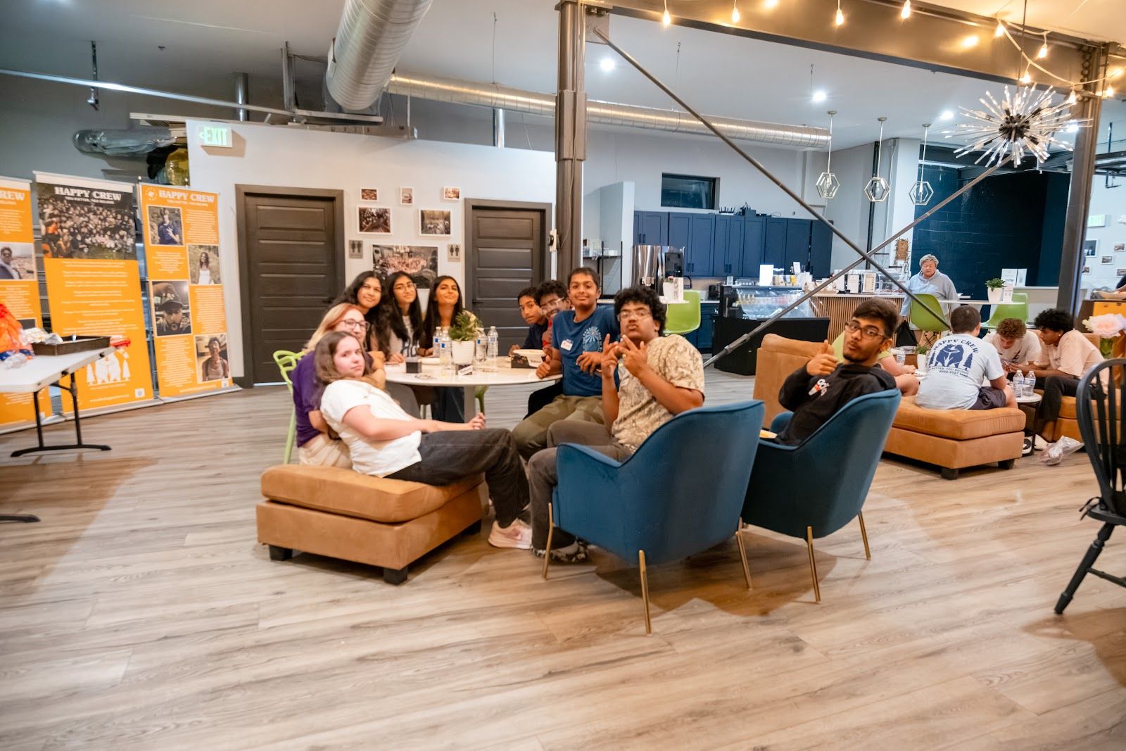 Teens on the couches and around the tables upstairs at the coffee house