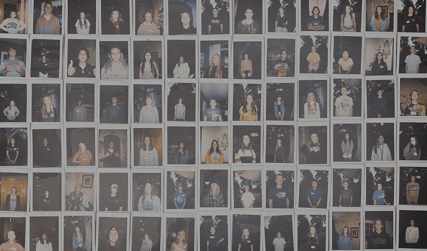 The Happy Crew polaroid wall at Happy Crew Coffee House
